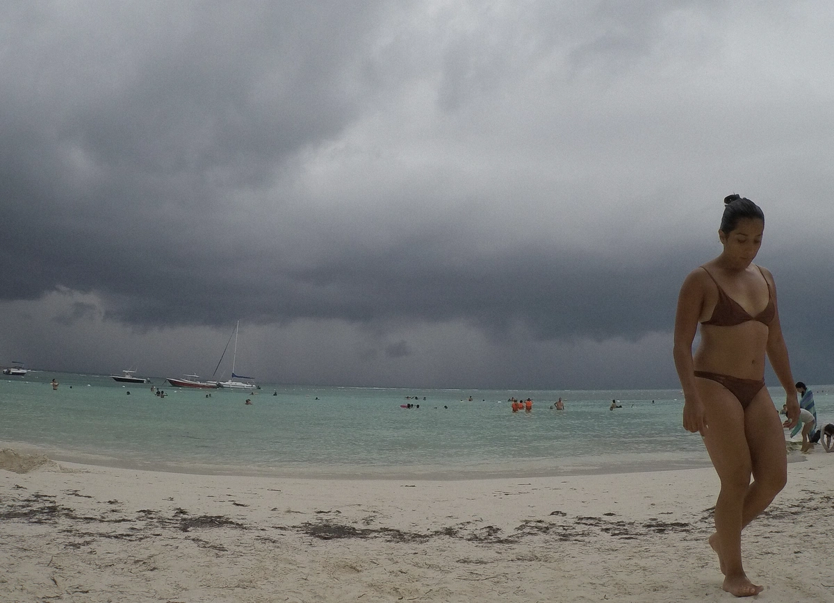 White sand beach and turquoise water curving around Akumal Bay on the Riviera Maya in Mexico